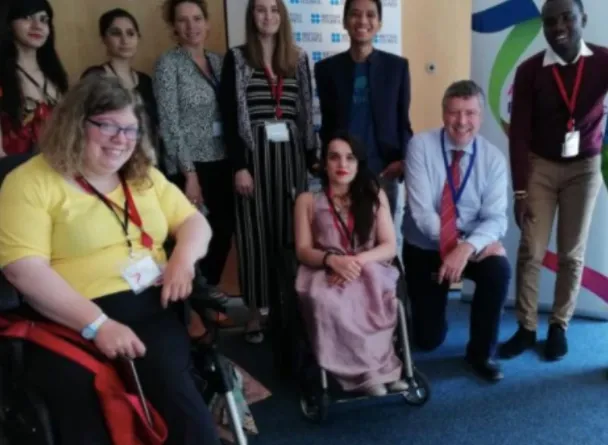 Coach Ryan is posing together with the participants of the forum organized by Department for International Development (DfID) and International Disability Alliance (IDA).