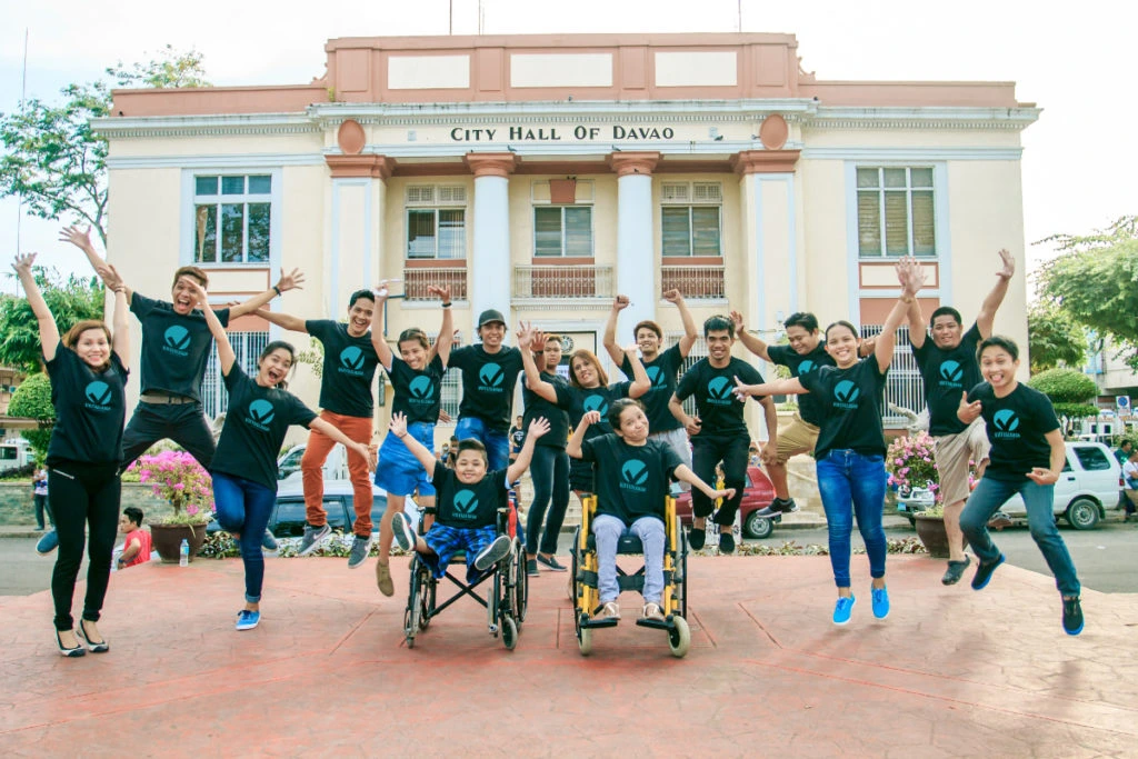 Virtualahan coaches and students having a jump shot in front of the City Hall of Davao.