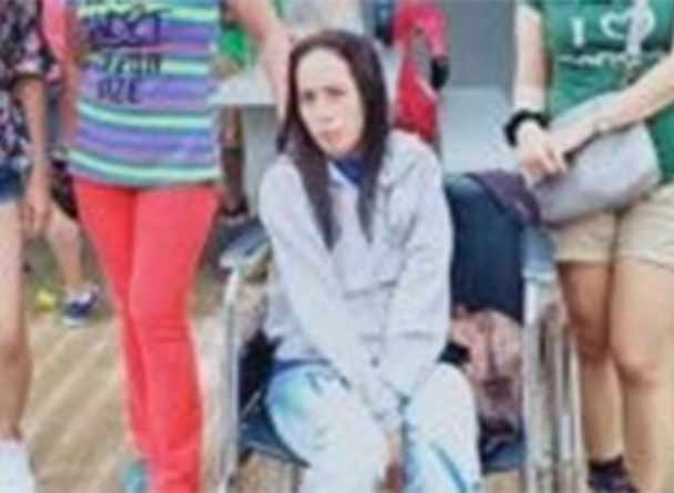Maria Angela Sabanal sitting on a wheelchair